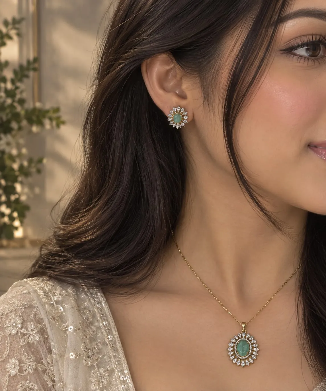 Emerald Bloom Pendant Set — Gold finish with intricate detailing, Green emerald-inspired centre stone with cubic zirconia accents