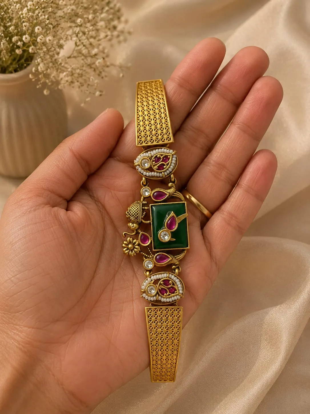 Mayura Jadau Mosaic Bracelet — Gold finish with intricate geometric detailing, Green synthetic stone and red synthetic stones and cubic zirconia (CZ) clear stones and pearl-style accents