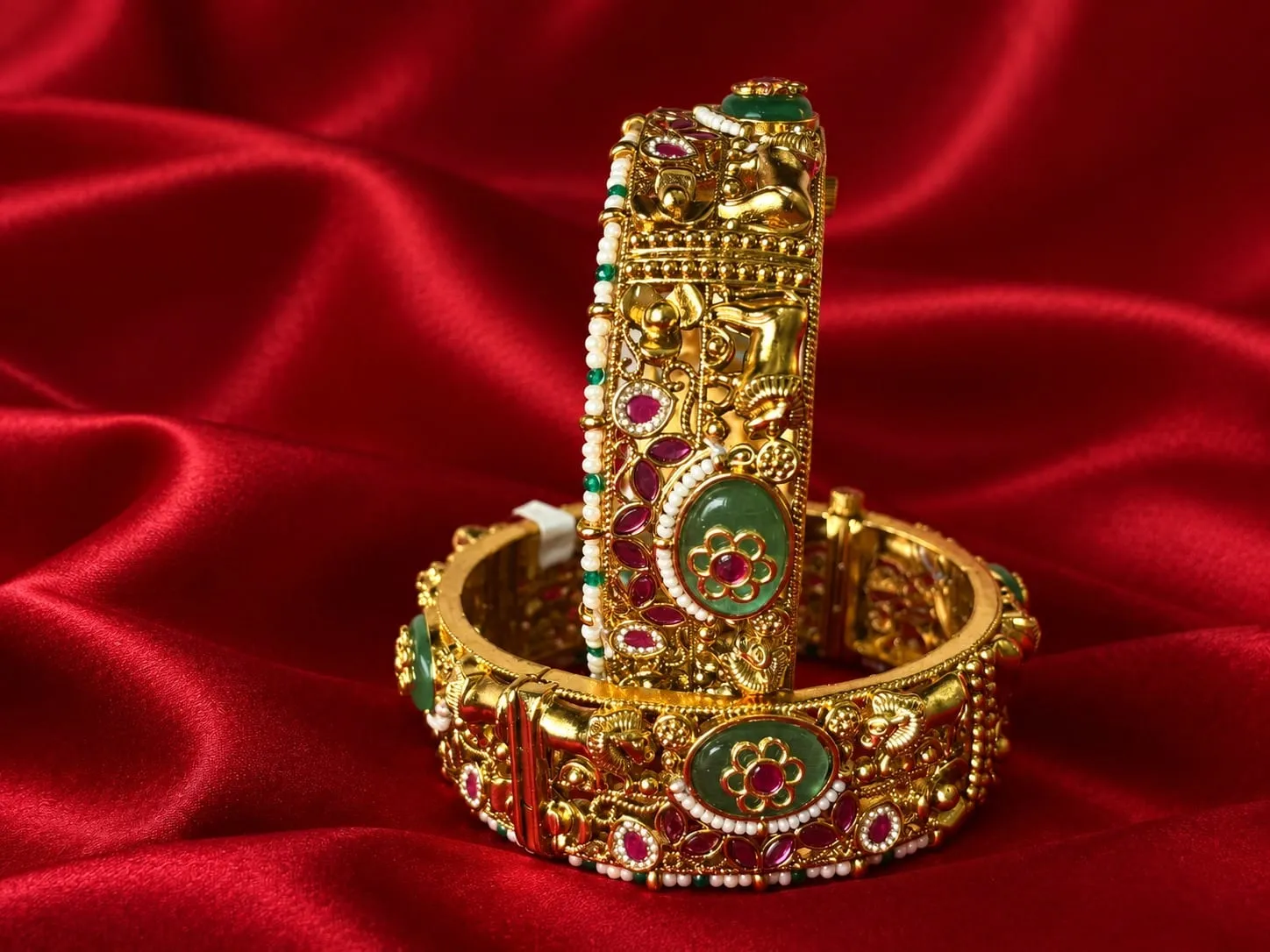 Rajwadi Pearl Kundan Bangles — Gold finish with intricate detailing, Kundan-style clear stones and red and green stones and pearl-style detailing